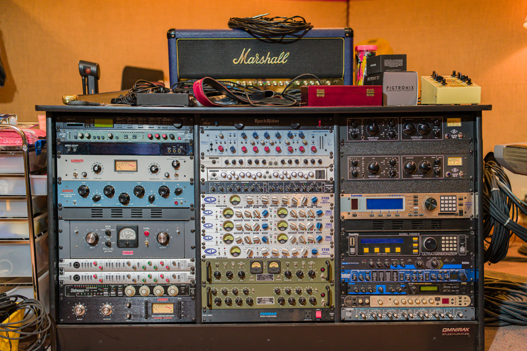 Rack of Shadow Sound Studio outboard gear with a Marshall amplifier head on top.