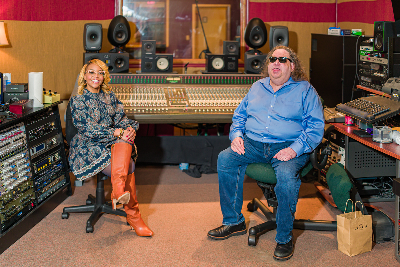Joey Stuckey speaking with a client during a consultation at Shadow Sound Studio.